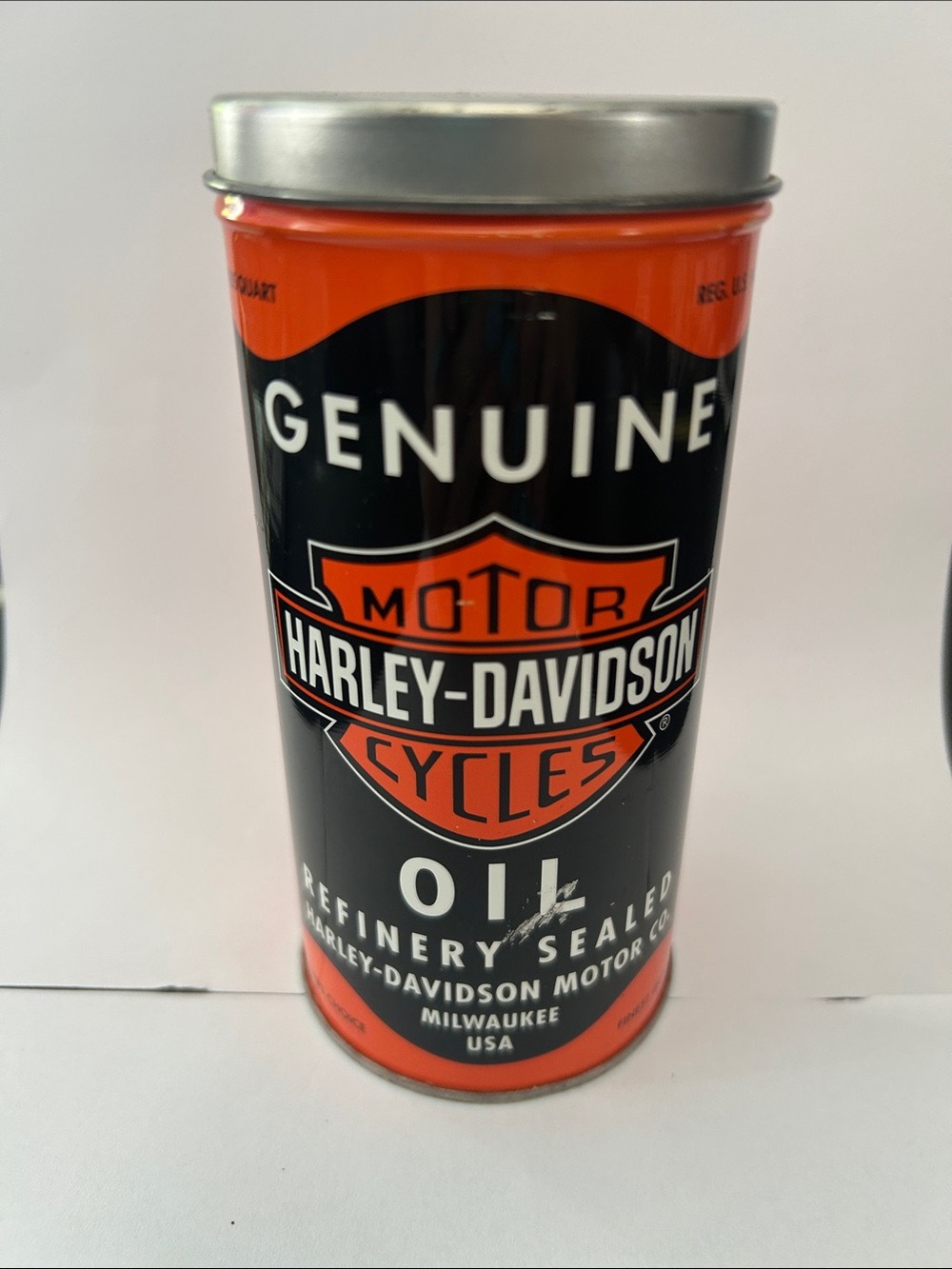 Harley-Davidson Black and Orange Motor Oil Canister candle. 3/4 left 2 burn.